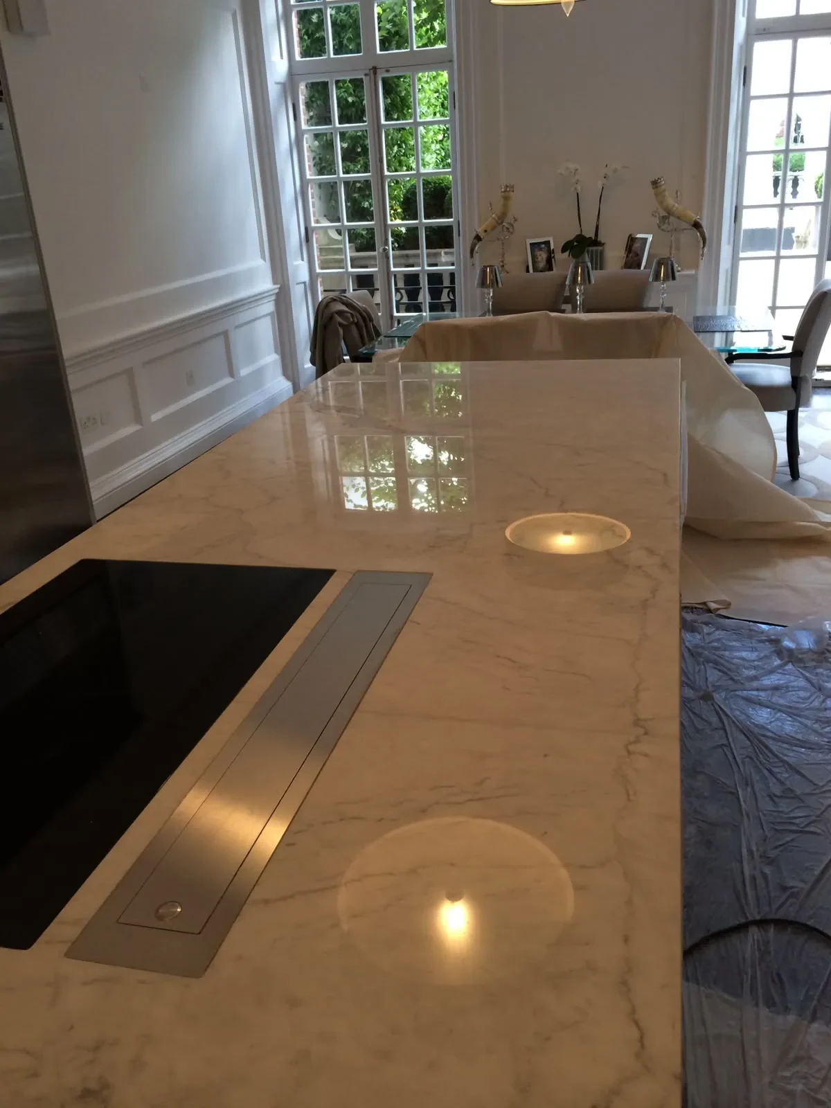 Carrara marble kitchen island with a finished polished surface