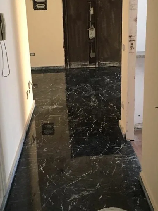 Black marble corridor after grinding and polishing