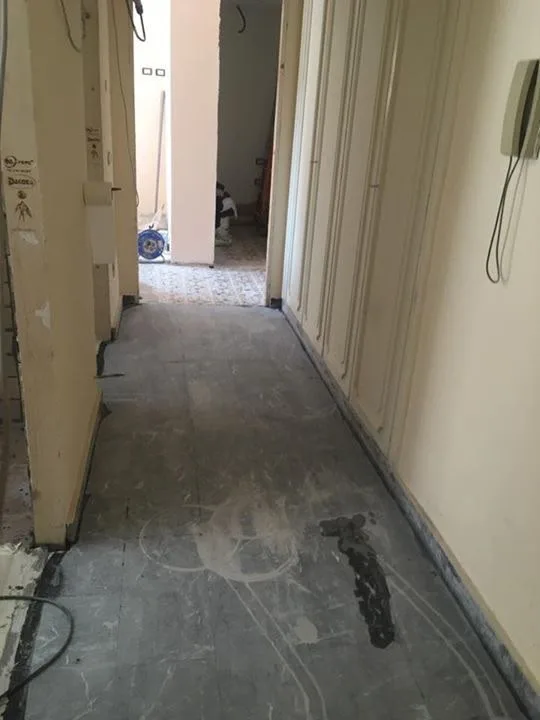Black marble corridor before grinding and polishing