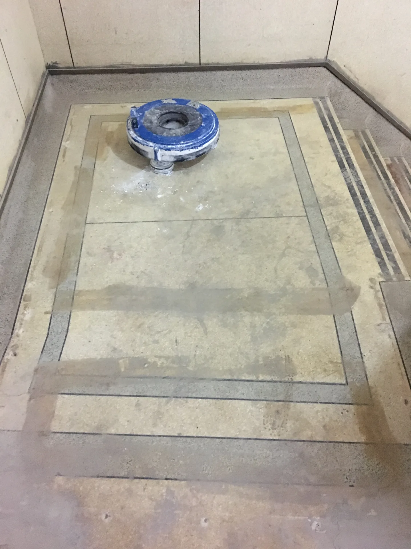 Terrazzo panel lobby floor with granite border before deep cleaning, honing and polishing