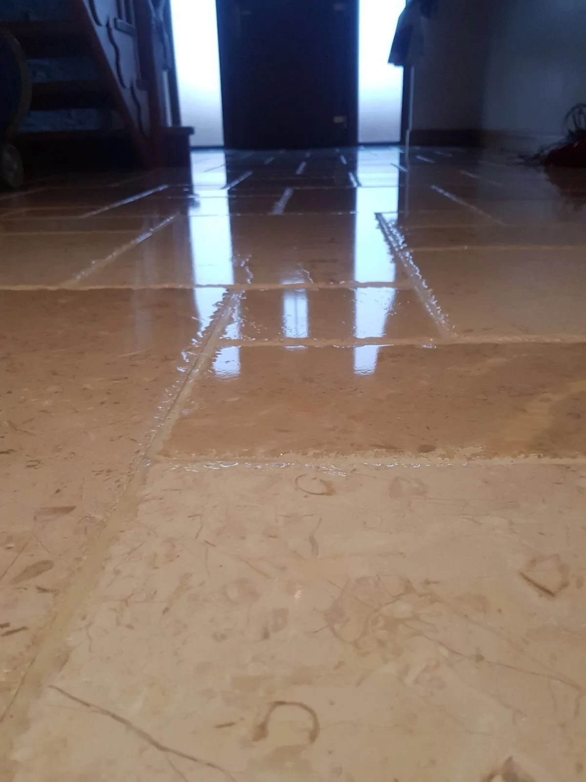 Limestone hallway showing polished and untreated stone in one frame