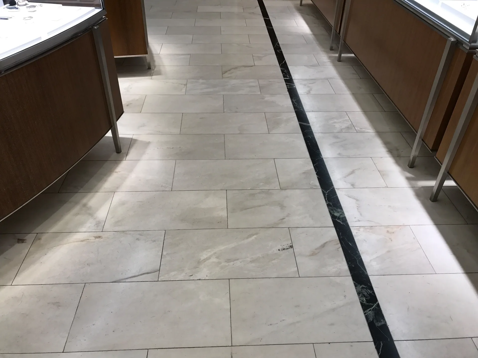 White marble retail floor before honing and polishing
